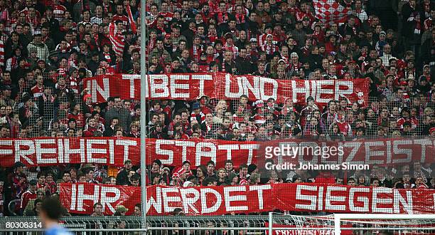 Supporters of Bayern Munich declare sympathy for the fight of the Tibetan people during the DFB Cup Semi Final match between FC Bayern Munich and VfL...