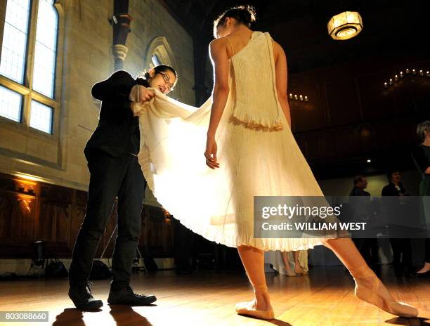 Dancer Robyn Hendricks has her outfit adjusted by Akira Isogawa at the launch of the Australian Ballet's 2011 season in Melbourne on September 14,...