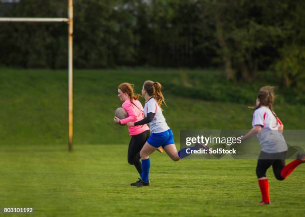 teen girls playing a game of rugby - angry rugby player stock pictures, royalty-free photos & images