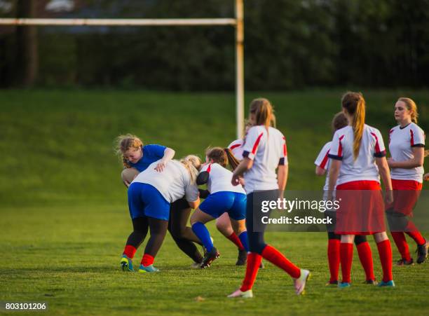 teen girls playing a game of rugby - angry rugby player stock pictures, royalty-free photos & images