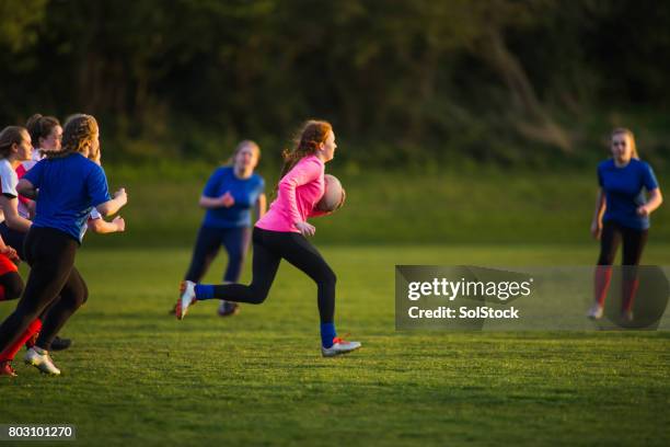 teen girls playing a game of rugby - angry rugby player stock pictures, royalty-free photos & images