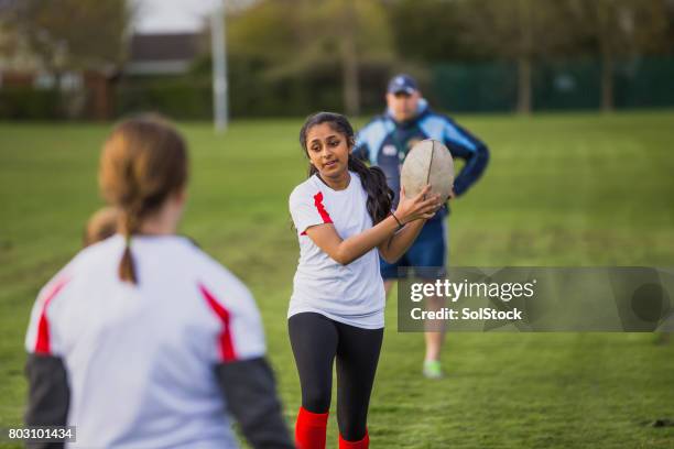 teen girls playing a game of rugby - angry rugby player stock pictures, royalty-free photos & images