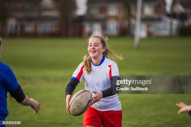 teen girls playing a game of rugby - angry rugby player stock pictures, royalty-free photos & images