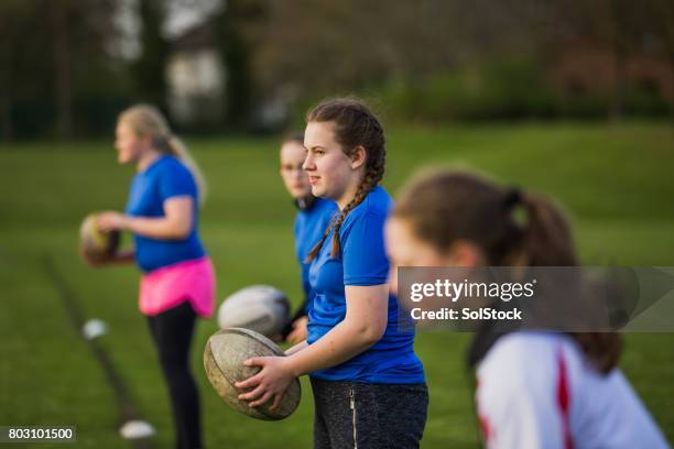 teen girls playing a game of rugby - angry rugby player stock pictures, royalty-free photos & images