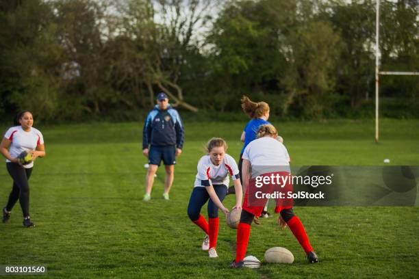 teen girls doing a rugby drill - sports drill stock pictures, royalty-free photos & images