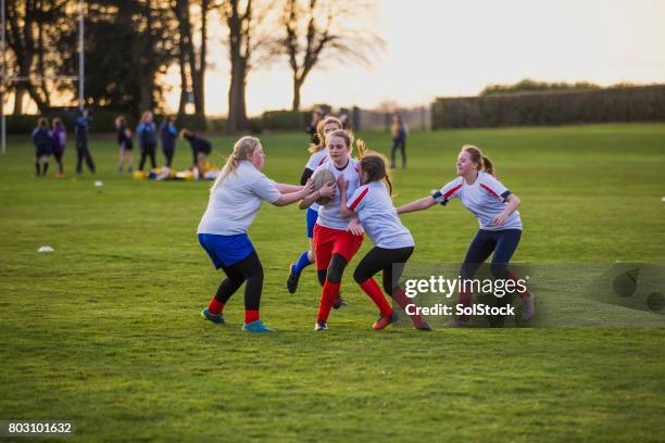 teen girls playing a game of rugby - angry rugby player stock pictures, royalty-free photos & images