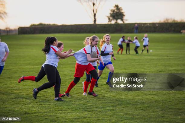 teen girls playing a game of rugby - angry rugby player stock pictures, royalty-free photos & images