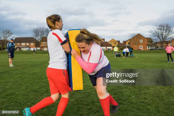 teen girls playing a game of rugby - sports drill stock pictures, royalty-free photos & images