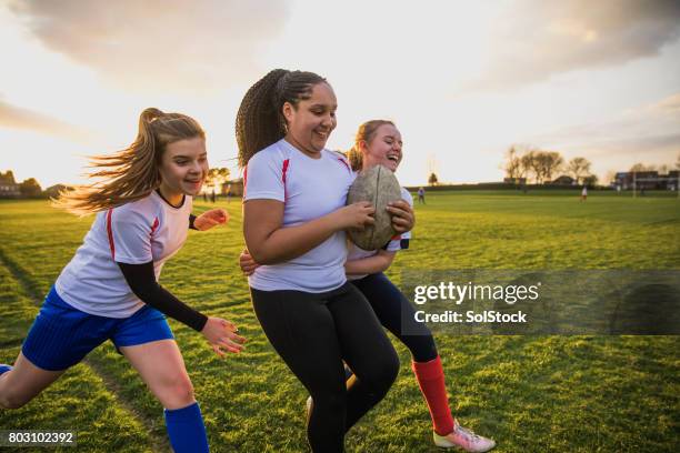 teen girls playing a game of rugby - angry rugby player stock pictures, royalty-free photos & images
