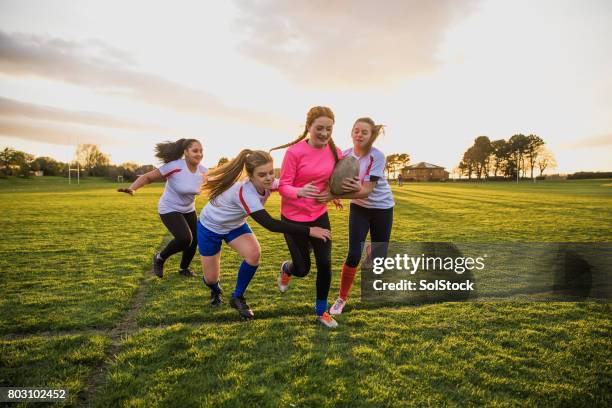 teen girls playing a game of rugby - angry rugby player stock pictures, royalty-free photos & images