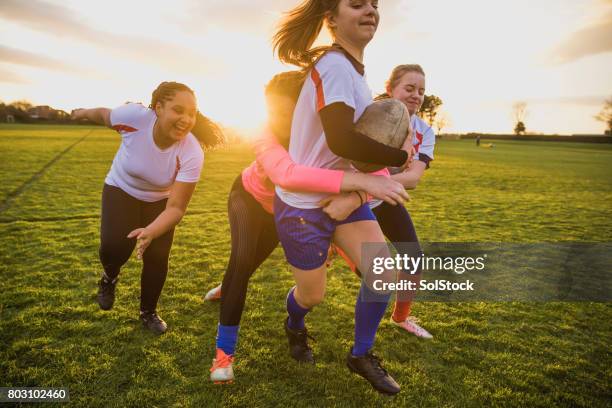teen girls playing a game of rugby - angry rugby player stock pictures, royalty-free photos & images
