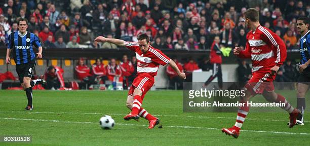 Franck Ribery of Munich scores the first goal during the DFB Cup semi final match between Bayern Munich and VfL Wolfsburg at the Allianz Arena on...