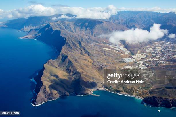 aerial photography view east of the clouds over de mountains in la aldea de san nicolás, gran canaria. canary islands, spain. - aldea stock-fotos und bilder