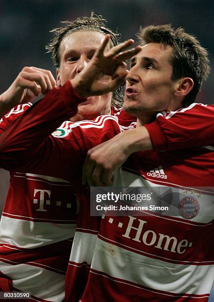 Miroslav Klose of Bayern Munich celebrates with teammate Marcell Jansen after scoring 2-0 during the DFB Cup Semi Final match between FC Bayern...