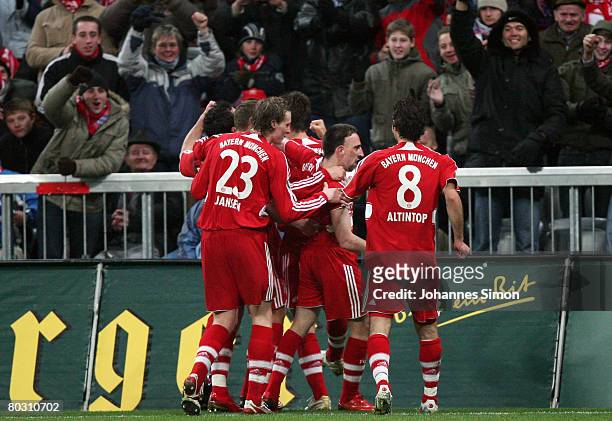 Franck Ribery of Bayern Munich celebrates with his teammates after scoring 1-0 during the DFB Cup Semi Final match between FC Bayern Munich and VfL...