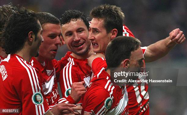 Franck Ribery of Munich celebrates scoring the first goal with his team mates Hamit Altintop , Lukas Podolski , Mark van Bommel and Miroslav Klose...