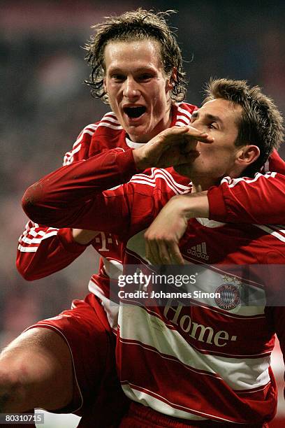 Miroslav Klose of Bayern Munich celebrates with teammate Marcell Jansen after scoring 2-0 during the DFB Cup Semi Final match between FC Bayern...