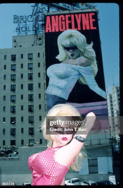Singer Angelyne poses in front of her billboard July 1987 in Los Angeles, CA. Angelyne will release her new album"Beware of My Boyfriend" this month...
