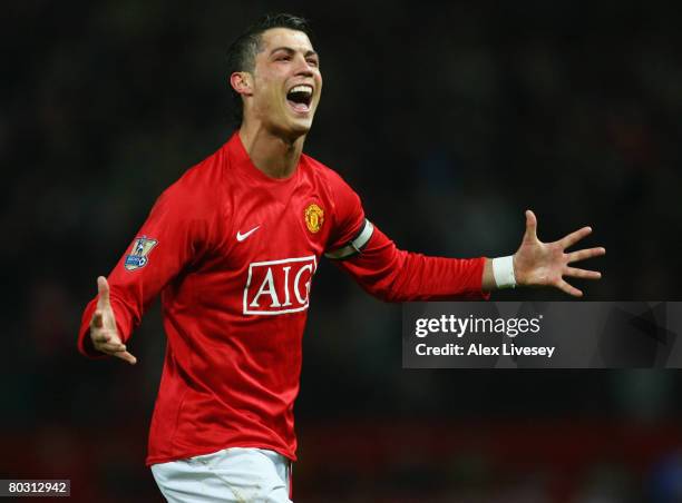 Cristiano Ronaldo of Manchester United celebrates as he scores their second goal during the Barclays Premier League match between Manchester United...