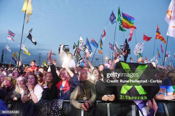 Festival goers attend day 4 of the Glastonbury Festival 2017 at Worthy Farm, Pilton on June 25, 2017 in Glastonbury, England.