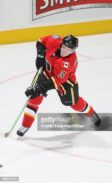 March 7: Dion Phaneuf of the Calgary Flames shoots the puck against the Nashville Predators during their NHL game at the Pengrowth Saddledome on...