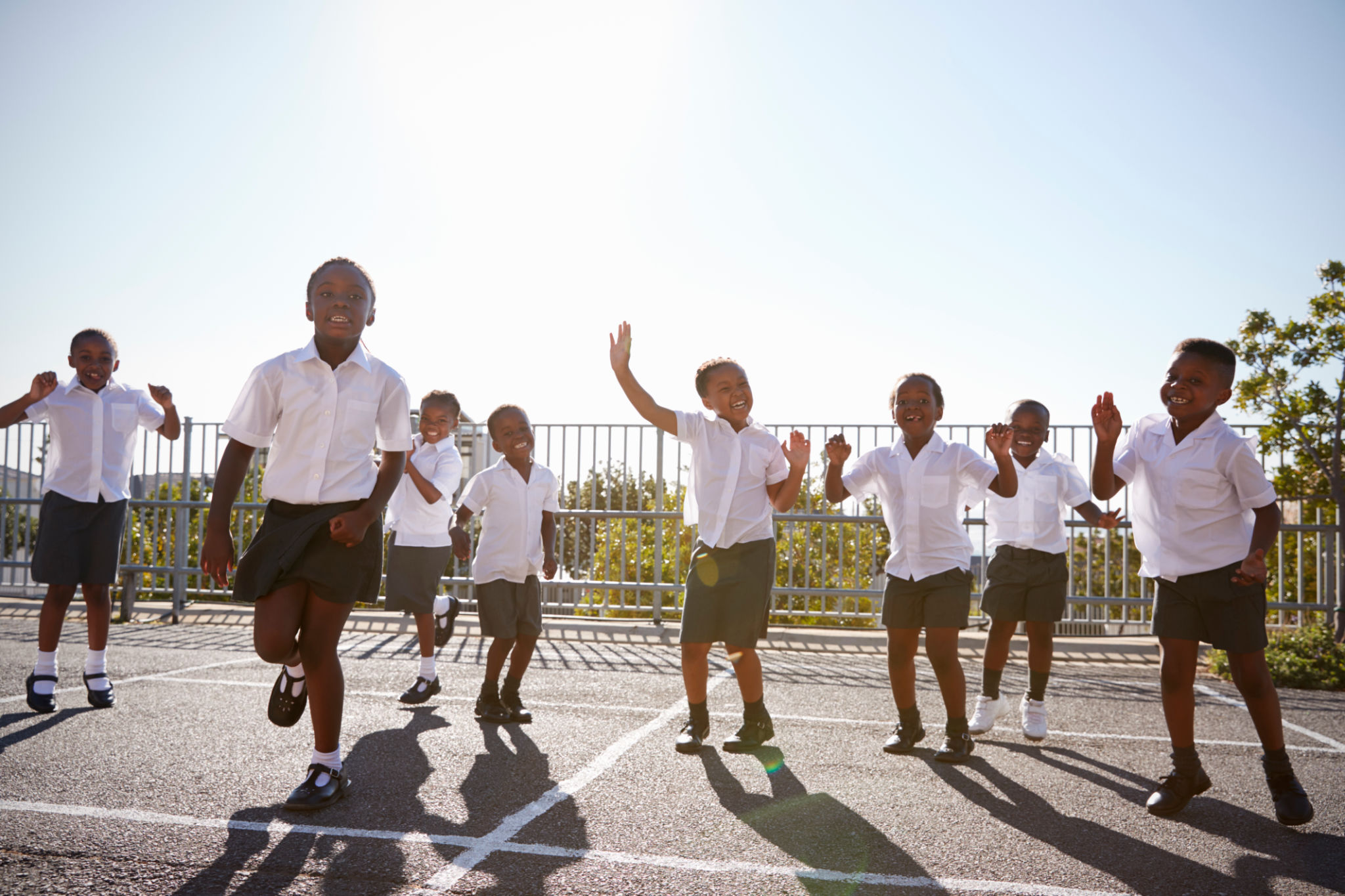 Elementary school kids having fun in school playground Elementary school kids having fun in school playground