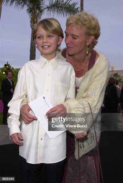 Child actor Serge Cockburn and mom Kirsty attend the premiere of the film "Crocodile Dundee In Los Angeles" April 18, 2001 at Paramount Studios in...