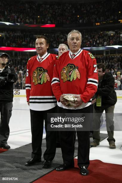 Former Chicago Blackhawks goalie Tony Esposito stands next to his brother Phil Esposito during a pre-game ceremony in his honor on March 19, 2008 at...