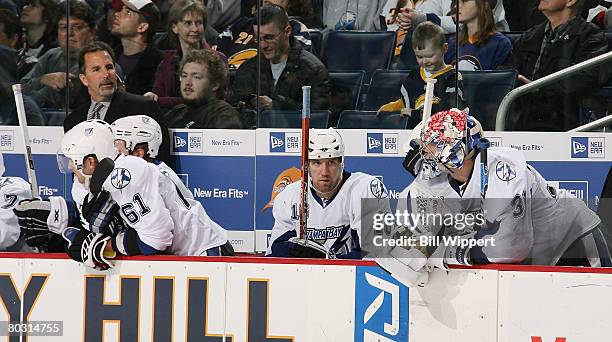 Head coach John Tortorella of the Tampa Bay Lightning casts a glance at goaltender Karri Ramo on the bench as Jason Ward looks on late in the third...