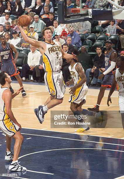 Troy Murphy of the Indiana Pacers brings down a rebound against the Charlotte Bobcats at Conseco Fieldhouse on March 19, 2008 in Indianapolis,...