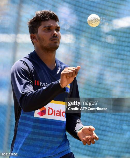 Sri Lankan cricketer Wanidu Hasaranga takes part in a practice session at Galle International Cricket Stadium in Galle on June 29 ahead of the first...