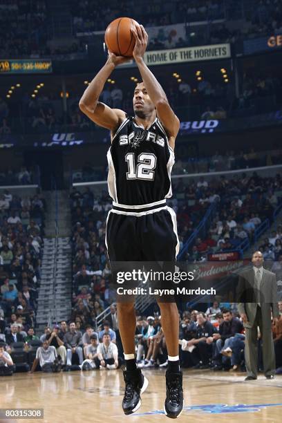 Bruce Bowen of the San Antonio Spurs goes up for the shot during the NBA game against the New Orleans Hornets on March 12, 2008 at the New Orleans...