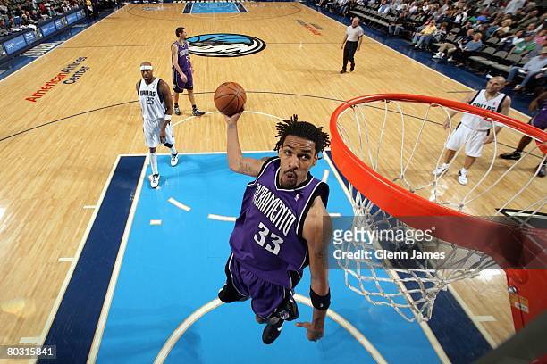 Mikki Moore of the Sacramento Kings goes up for the shot during the NBA game against the Dallas Mavericks at the American Airlines Center on February...