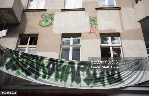 Banner that reads "Risikokapital" during an eviction operation at the Friedel 54 shop in Neukoelln district on June 29, 2017 in Berlin, Germany. The...