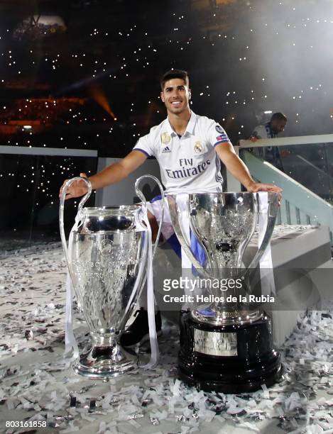 Marco Asensio celebrates during the Real Madrid celebration the day after winning the 12th UEFA Champions League Final at Santiago Bernabeu stadium...