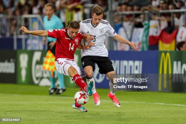 Casper Nielsen of Denmark and Yannick Gerhardt of Germany battle for the ball during the UEFA European Under-21 Championship Group C match between...