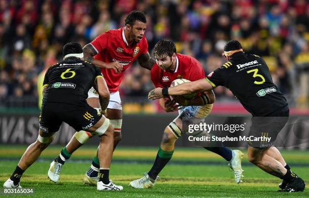 Wellington , New Zealand - 27 June 2017; Iain Henderson of the British & Irish Lions is tackled by Jeff Toomaga-Allen of of the Hurricanes during the...