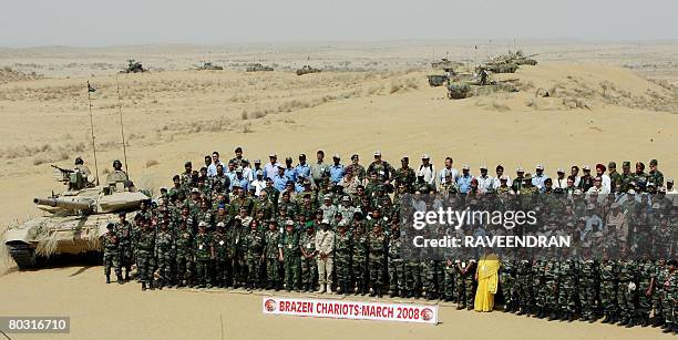 Foreign Military officers pose for a photograph during joint Indian Army and Air Force exercises entitled 'Brazen Chariots' at Pokharan, In India's...