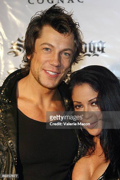Actress Apollonia Kotero and actor Emmanuel Delcour attend MySpace Album Release Party for Snoop Dogg's "Ego Trippin" at the Opera Crimson on March...