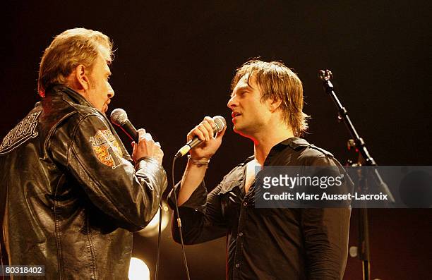 David Hallyday and his father Johnny Hallyday on stage at the Cigale in Paris on March 17,2008