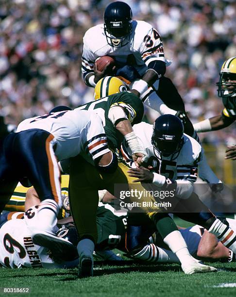 Chicago Bears Hall of Fame running back Walter Payton goes over the pile during a 9-7 victory over the Green Bay Packers on September 16 at Lambeau...