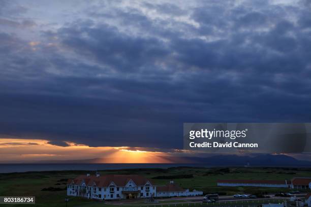 General view of the clubhouse as the sun sets in the late evening of the lighthouse with the Island of Arran in the background at Trump Turnberry...