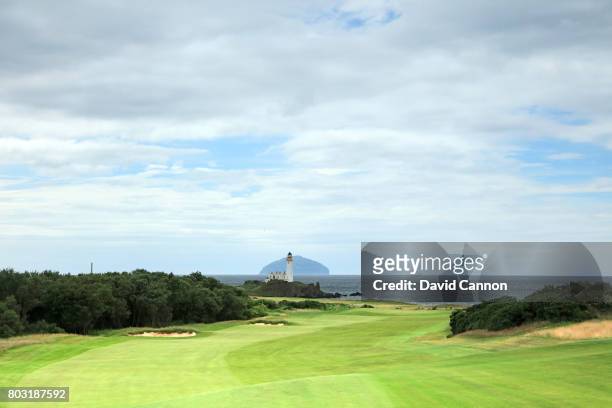 View looking down the fairway of the par 5, 12th hole with the Turnberry Lighthouse and the island of Ailsa Craig behind on the newly opened King...