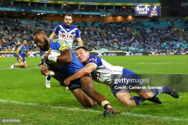 Semi Radradra of the Eels scores a try during the round 17 NRL match between the Parramatta Eels and the Canterbury Bulldogs at ANZ Stadium on June...