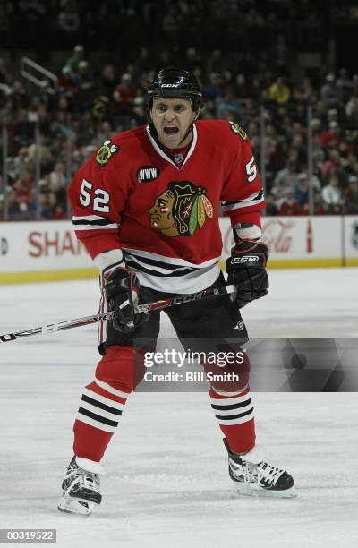 Dustin Byfuglien of the Chicago Blackhawks yells down the ice during a game against the Calgary Flames on March 16, 2008 at the United Center in...