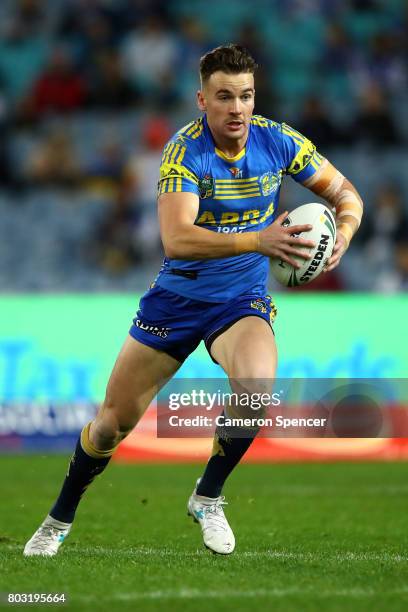 Clinton Gutherson of the Eels runs the ball during the round 17 NRL match between the Parramatta Eels and the Canterbury Bulldogs at ANZ Stadium on...