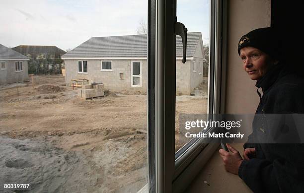 Debbie O'Doyle looks out on the self-build housing estate being built in Rock, near Padstow on March 20 in Cornwall, United Kingdom. Their house is...