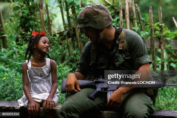 Rangers Soldier With A Little Girl After The Invasion Of Grenada By The United States And The Organisation Of Eastern Caribbean States, in October...