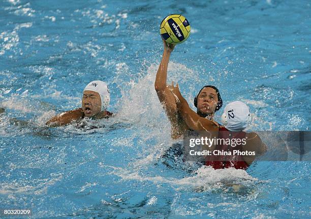 Ericka Lorenz of the USA vies for the ball with Qiao Leiying of China in a match between China and USA's national team during the "Good Luck Beijing"...