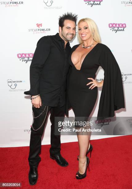 Musician Greg Martin of the Rock Band Harmful If Swallowed and Burlesque Magician Suzie Malone attend the 2nd annual "Babes In Toyland Support Our...